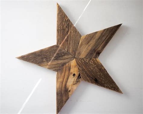 A Wooden Star Hanging On The Wall