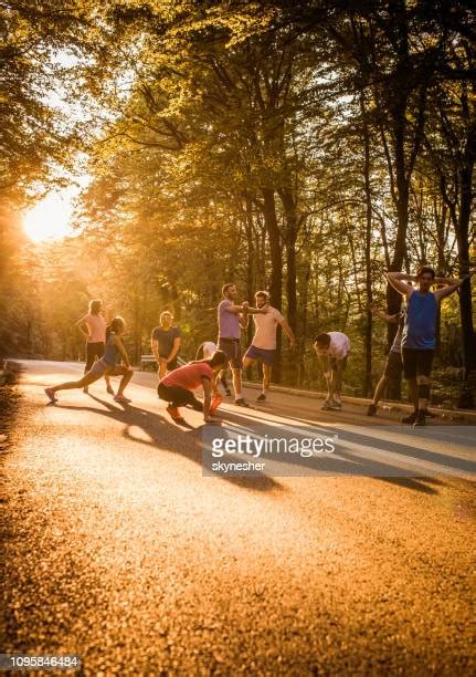 Marathon Runners Stretching Photos And Premium High Res Pictures