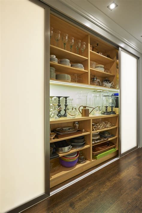 Kitchen & bath environments inc. Sliding door in front of shelves. Front Row Kitchens ...