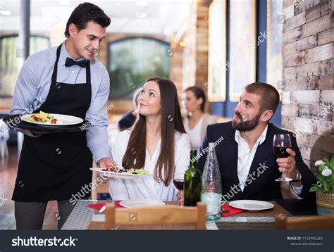 Professional Positive Waiter Man Serving Company Stock Photo 1122405233