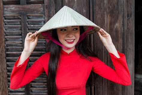 Vietnamese Women In Ao Dai Traditional Costume And Conical Hat By Bisual Studio
