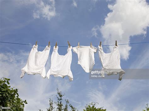 Baby Clothes Drying On Washing Line High Res Stock Photo Getty Images