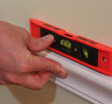 Removing the chair rails from the walls. How to Install a Chair Rail | | A Pinch of Joy