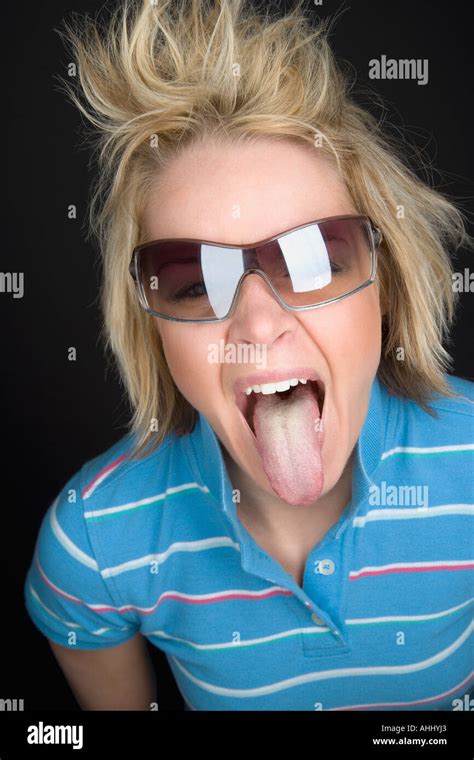 Woman Sticking Her Tongue Out Stock Photo Alamy