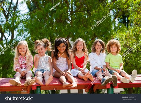 Portrait Happy Children Sitting Together Wooden Stock Photo 148266251