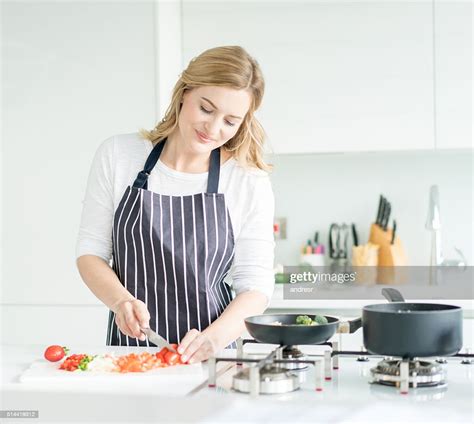 Woman Cooking Dinner At Home High Res Stock Photo Getty Images