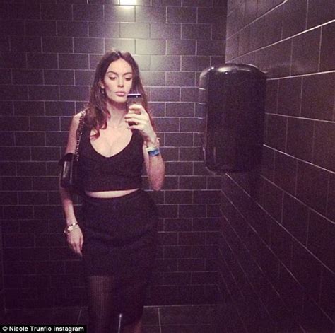 nicole trunfio shows off curvier figure and voluptuous cleavage in all black ensemble as she