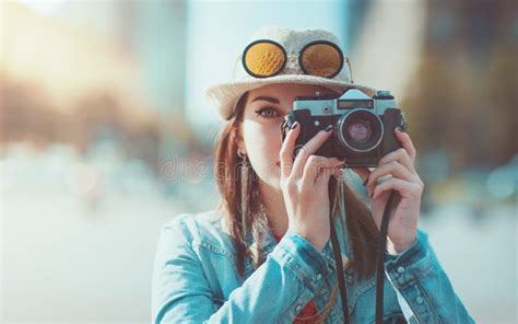 Hipster Girl Making Picture With Retro Camera Focus On Camera Stock