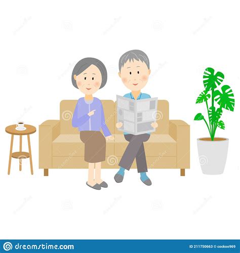 Grandpa And Grandma Sitting On The Couch And Reading The Newspaper