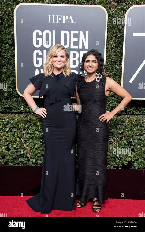 actor amy poehler and saru jayaraman attend the 75th annual golden globes awards at the beverly