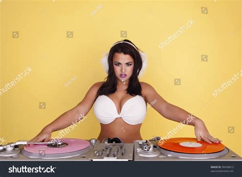 Sexy Female Dj Wearing A White Bikini Top As She Plays Colourful Records Sexy Female Dj Stock