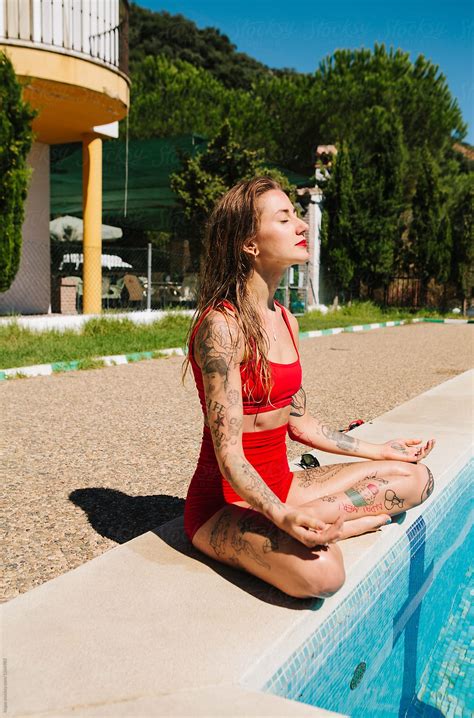 Beautiful Tattooed Woman Sitting Next To A Swimming Pool By Kkgas