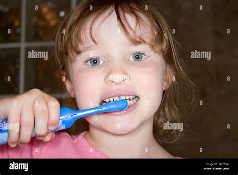 Young Girl Brushing Her Teeth Stock Photo Alamy