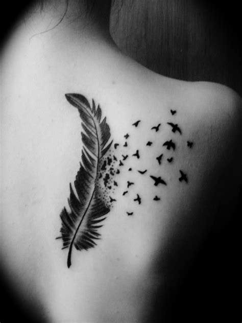 Bird Flying From Feather Tattoo On Back