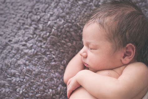 Portrait Of A Sleeping Newborn Baby By Stocksy Contributor Lea