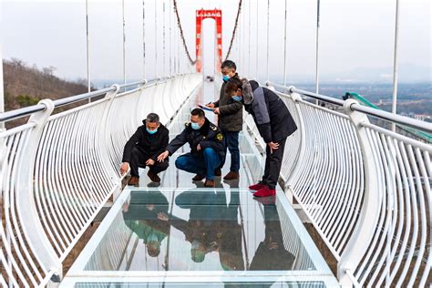 Man Left Clinging To Shattered Glass Bridge In Northern China