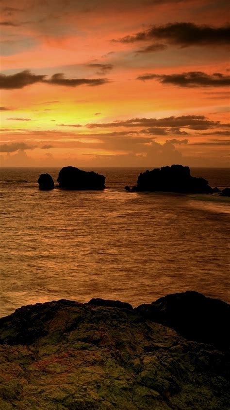 La estética que te gusta, los colores que te agradan, los temas que te apasionan. Amanecer en el mar, fondo de pantalla | Ringtina