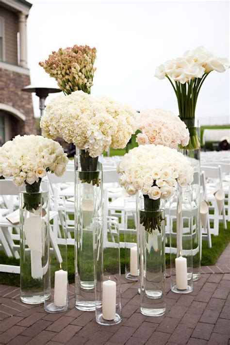 Arrange White Flowers In Tall Glass Vases For Modern Ceremony Decor