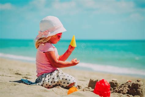 Little Girl Play With Sand On Beach Stock Photo Image Of Travel