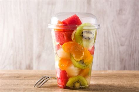 Fresh Cut Fruit In A Plastic Cup On Wood Stock Image Image Of Fruit