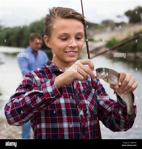 Teenager Boy Holding Catch Fish On Hook Stock Photo Alamy