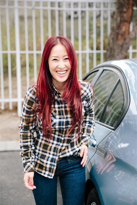 Pretty Asian Redhead Smiling And Laughing By Stocksy Contributor