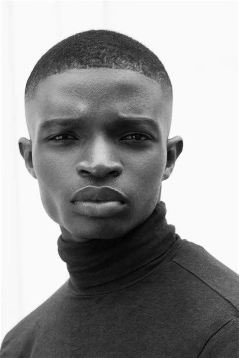 Natural light fashion portrait of new face, Nigerian dark skin male