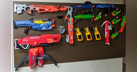 Space out 2 pegs at approximately the same length as the nerf gun and hang the gun hang a wire rack on your wall using screws, anchors, or other attachments depending on the wall material. Nerf Gun Wall Rack Diy - How To Build A Tactical Nerf Gun Wall - Diy gun rooms and gun walls ...