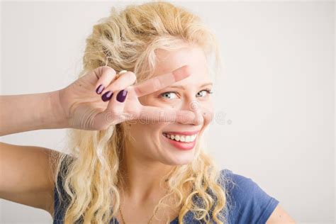 Girl Holding Two Fingers In Front Of Her Face Stock Image Image Of