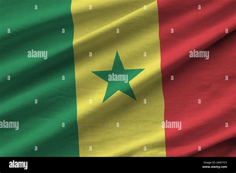 Senegal Flag With Big Folds Waving Close Up Under The Studio Light