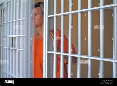Single Male Prisoner Behind Bars In Jail Cell Usa Stock Photo Alamy