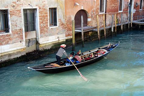 Man Canoe Building Venice Italy Gondola Channel Water Nautical