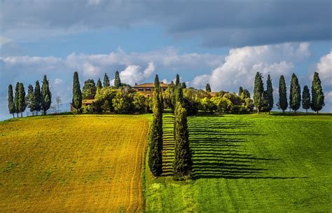 878340 Italy Tuscany Hill Trees Sun Clouds Grass Rays Of Light