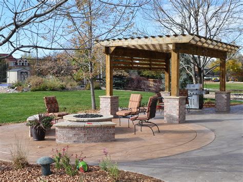 A fire pit with a wide burning area like this one needs to be used in a types of fire pits wood burning fire pits. renovated pergola with gas firepit, colored concrete ...