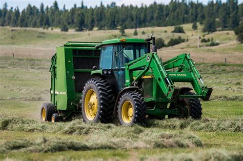 Tractor baling hay - CSC
