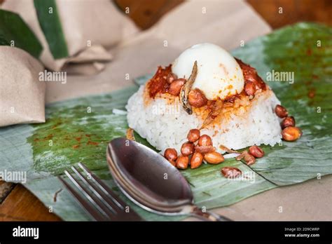 Simple Authentic Nasi Lemak Wrapped In Banana Leaf For Breakfast Stock