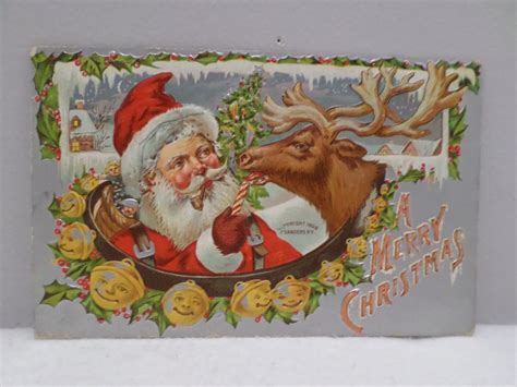 1908 christmas postcard santa claus feeding candy cane to reindeer unposted