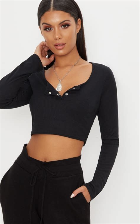 Black Rib Popper Front Long Sleeve Crop Top Prettylittlething Ca