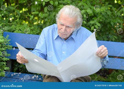 Elderly Man Sitting Alone On A Bench In The Park Stock Photo Image Of