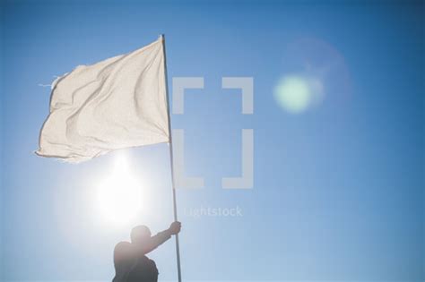 A Man Carrying A White Flag Of Surrender — Photo — Lightstock