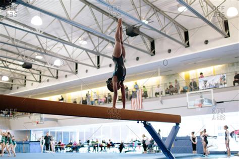 African American Girl Doing A Handstand On A Balance Beam Stock Photo