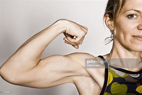Blond Woman Flexes Bicep Photo Getty Images