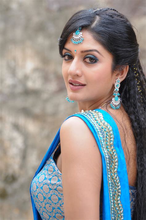 vimala raman hot in bikini blouse and blue saree flaunting beauty in a song sequence page 1