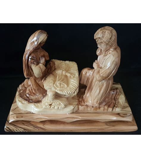 Joseph And Mary Kneeling With Jesus