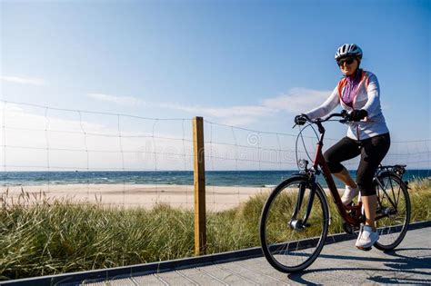 Healthy Lifestyle Mid Aged Woman Riding Bicycles Stock Image Image Of Beach Cycling 101337051