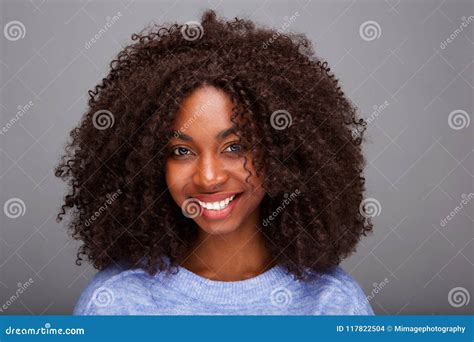 Beautiful African American Woman With Curly Hair On Gray Background