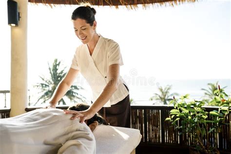 Female Massage Therapist Giving A Massage At A Spa Stock Photo Image