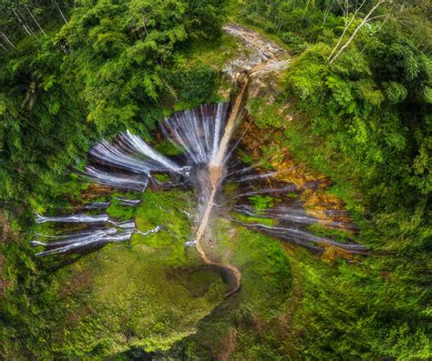 Aerial View Of Tumpak Sewu Waterfall Surrounded By Jungle Indonesia