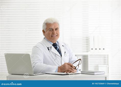 Portrait Of Doctor In White Coat At Workplace Stock Image Image Of