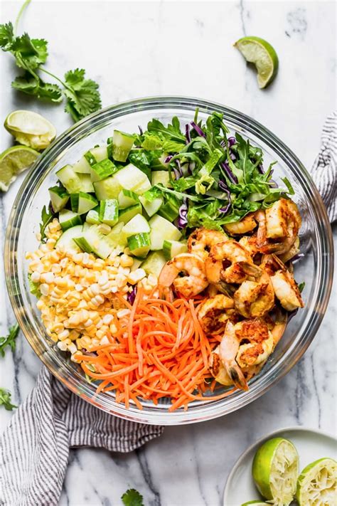 Evenly drizzle the dressing over both salads and serve with lime wedges. Spicy Thai Shrimp Salad - Skinnytaste